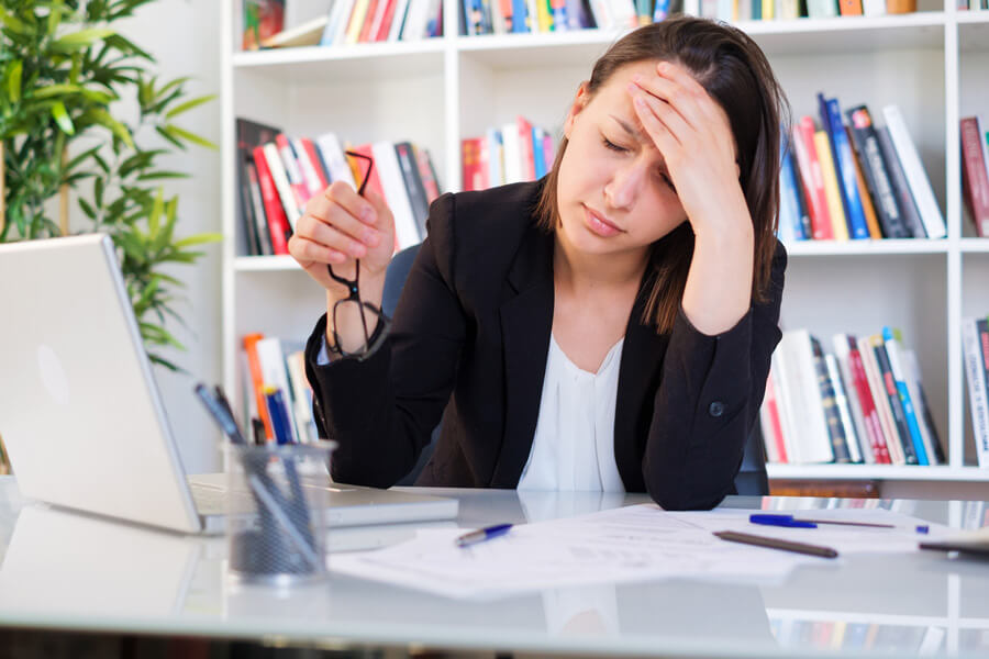 Frustrated woman at computer
